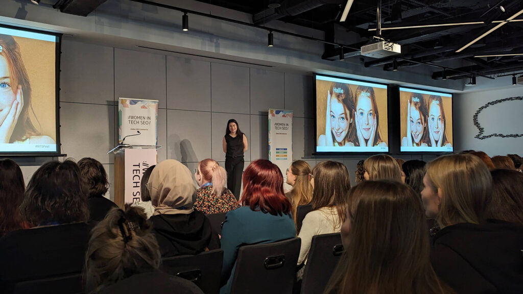 Grace Frohlich, SEO consultant on stage at the Women in Tech SEO event in London on 8th of March 2024, International Women's Day